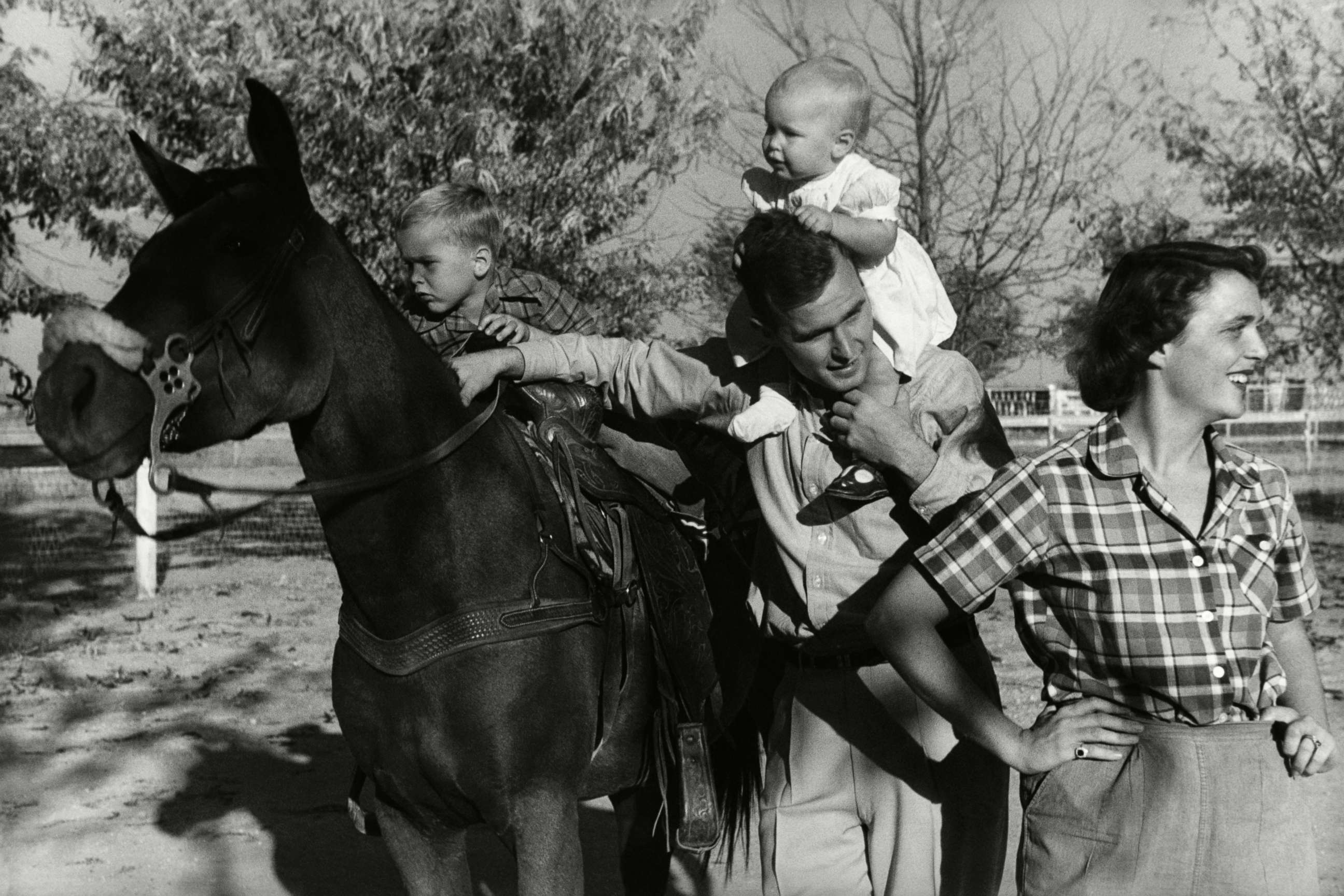 PHOTO: George H. W. Bush with his wife, Barbara, with  their children Pauline (Robin) and George W. on a horse in the yard of their Midlands, Texas ranch, Dec. 11, 1950.