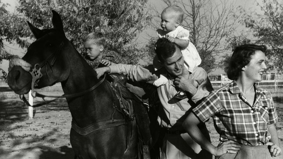 George H. W. Bush with his wife, Barbara, with their children Pauline (Robin) and George W. on a horse in the yard of their Midlands, Texas ranch, Dec. 11, 1950.