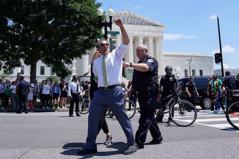 PHOTO: Representatives Andy Levin and Rashida Tlaib are detained during an abortion rights protest outside of the Supreme Court, July 19, 2022. 