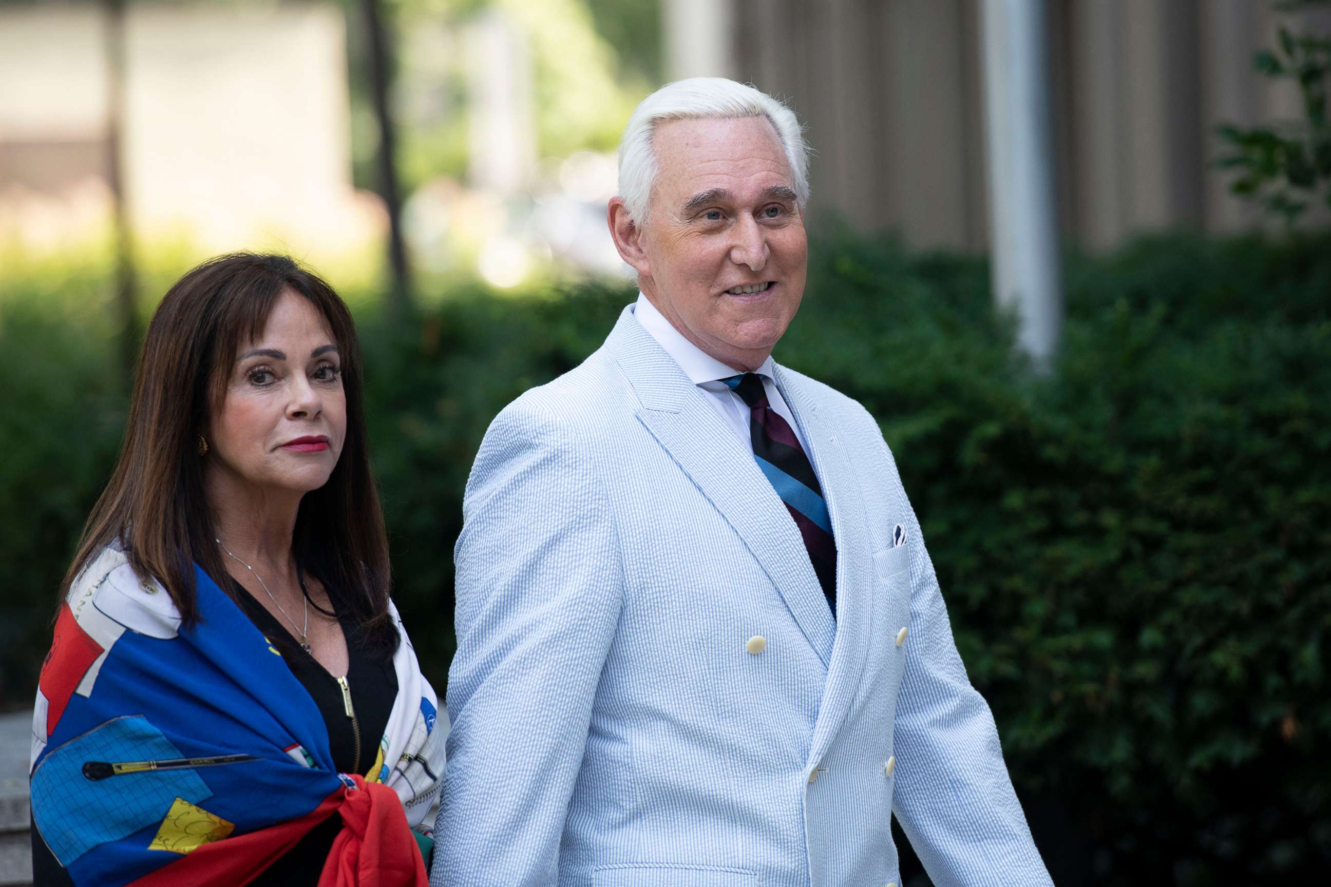 PHOTO: Roger Stone, a longtime confidant of President Donald Trump, accompanied by his wife Nydia Stone, left, arrives at federal court in Washington on July 16, 2019. 