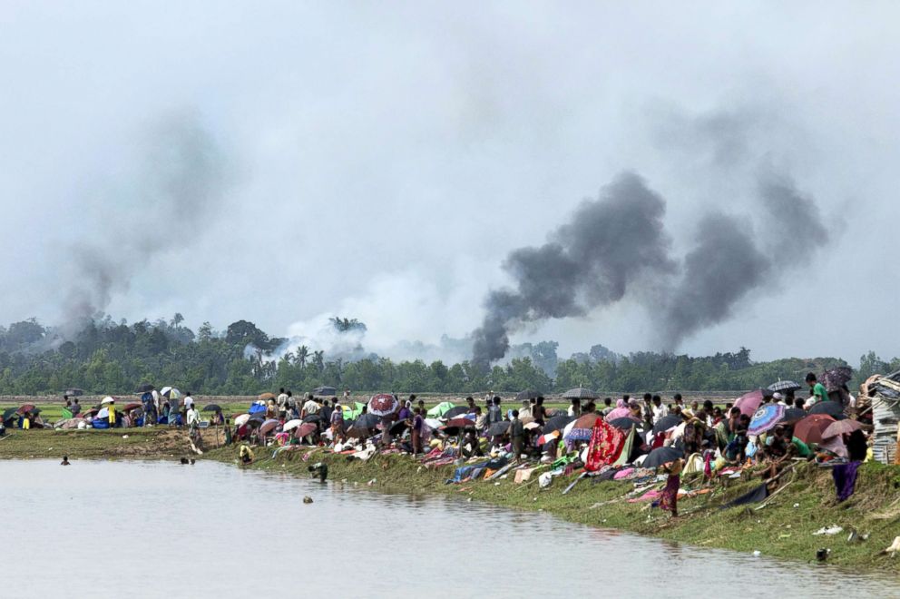 PHOTO: Smoke billows above what is believed to be a burning village in Myanmar's Rakhine state as members of the Rohingya Muslim minority take shelter in a no-man's land between Bangladesh and Myanmar in Ukhia, Bangladesh, Sept. 4, 2017.