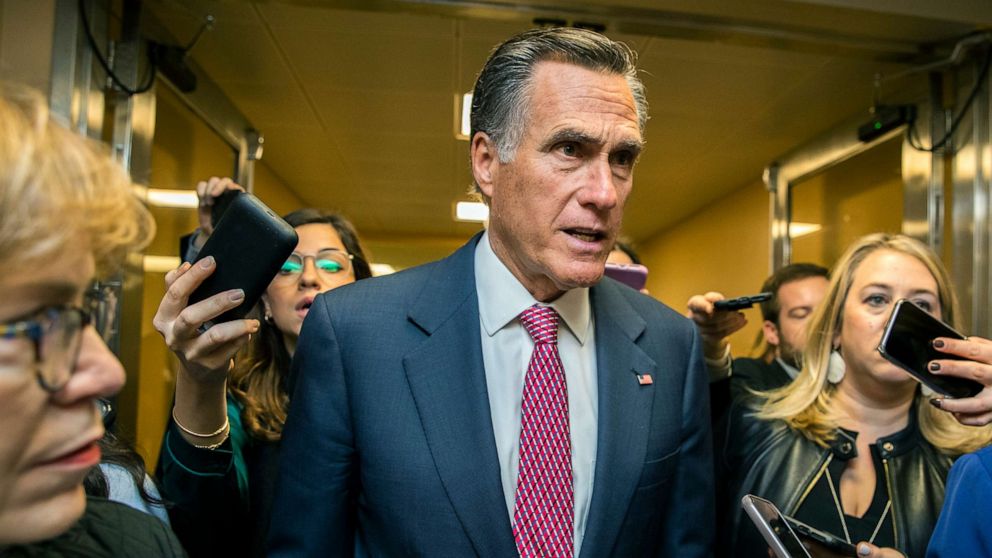 PHOTO: Sen. Mitt Romney speaks to reporters as he arrives at the Capitol, Jan. 27, 2020, during the impeachment trial of President Donald Trump.