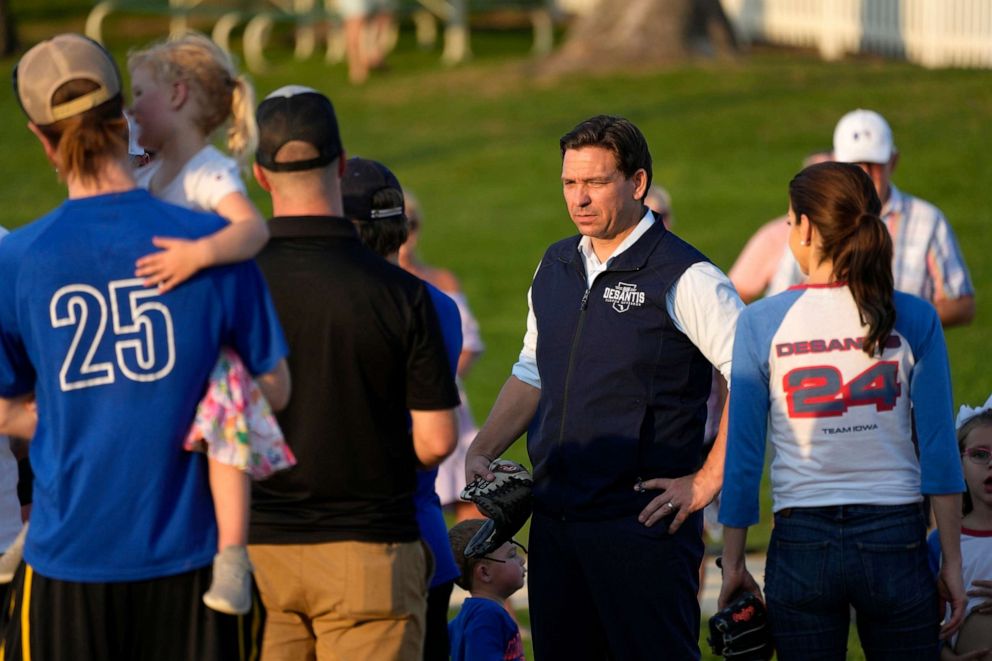 PHOTO: Republican presidential candidate Florida Gov. Ron DeSantis talks with local players during a campaign stop at the Field of Dreams movie site, Aug. 24, 2023, in Dyersville, Iowa.