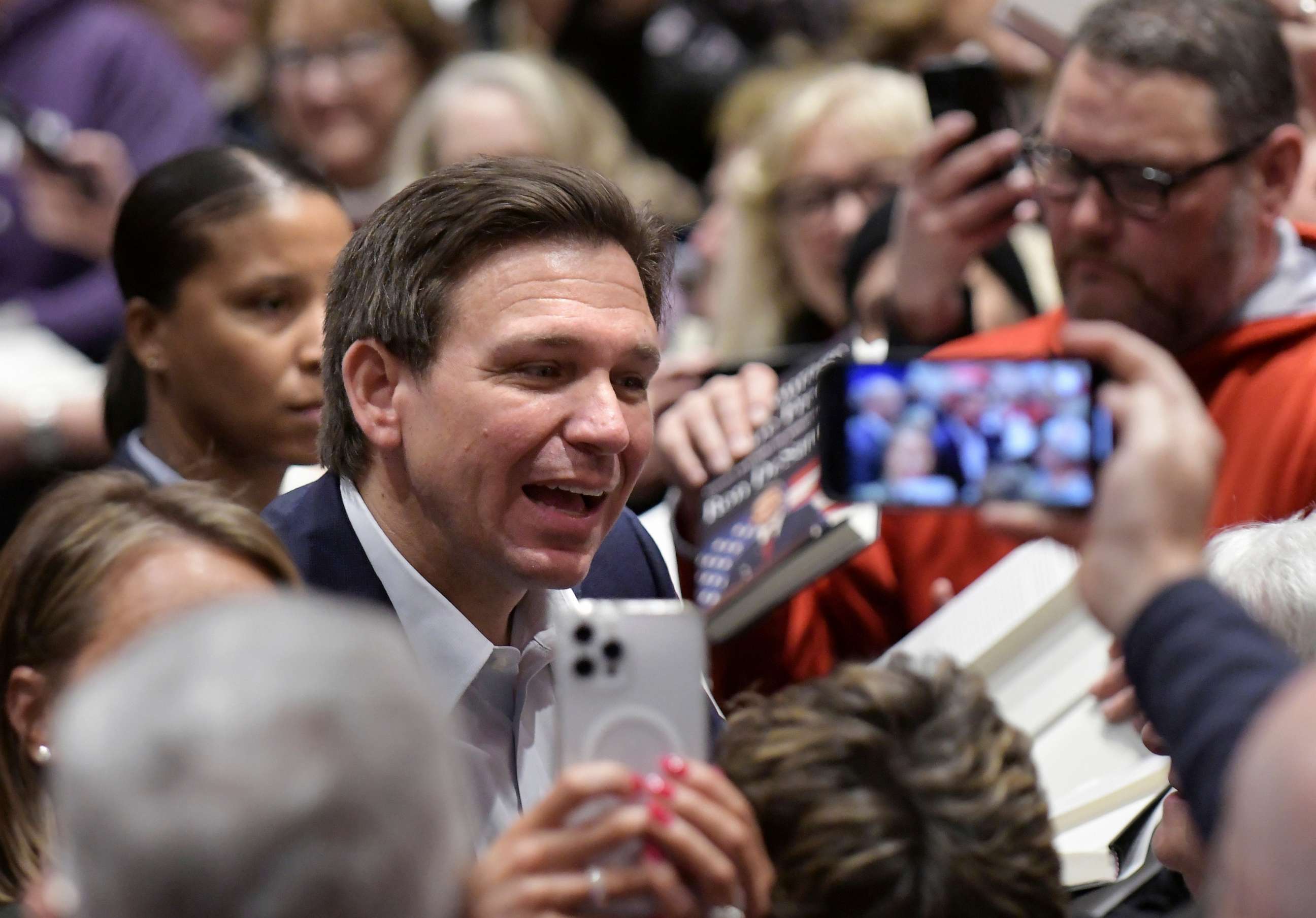 PHOTO: Florida Gov. Ron DeSantis greets people in the crowd during an event, Mar. 10, 2023, in Davenport, Iowa.