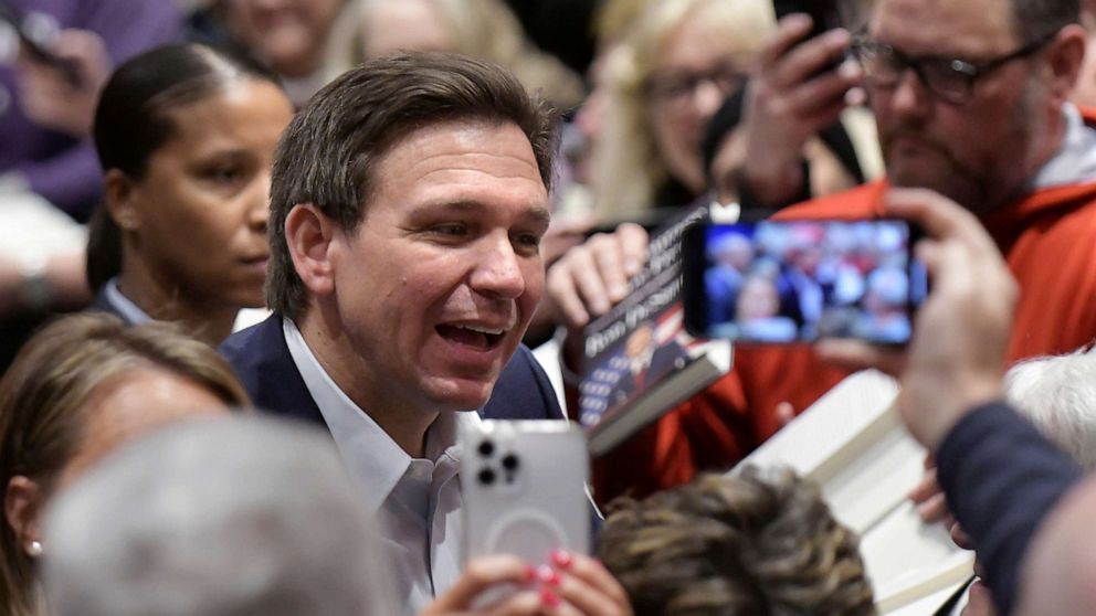 PHOTO: Florida Gov. Ron DeSantis greets people in the crowd during an event, Mar. 10, 2023, in Davenport, Iowa.
