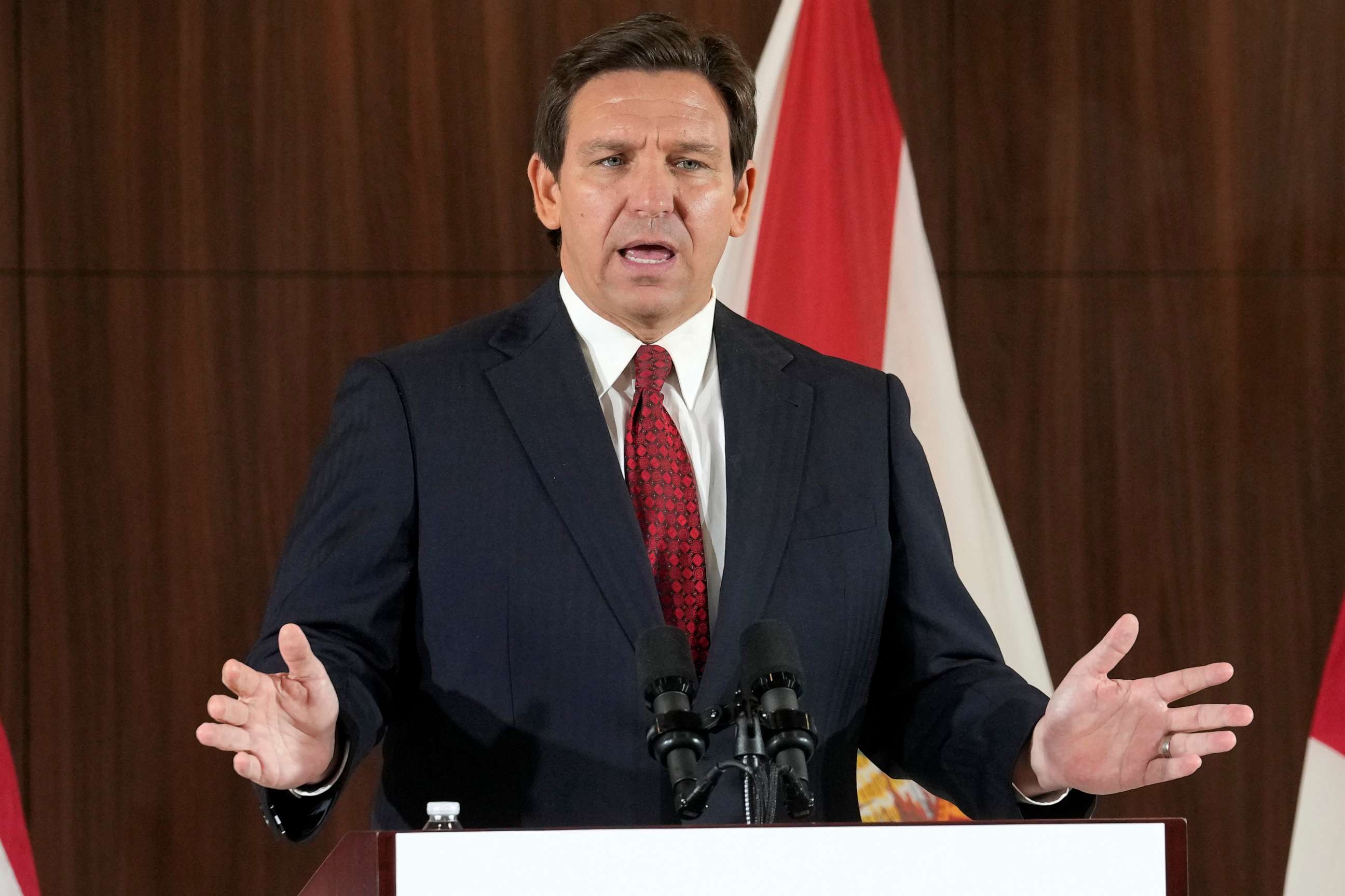 PHOTO: Florida Gov. Ron DeSantis listens to others during a news conference where he spoke of new law enforcement legislation that will be introduced during the upcoming session, Jan. 26, 2023, in Miami.