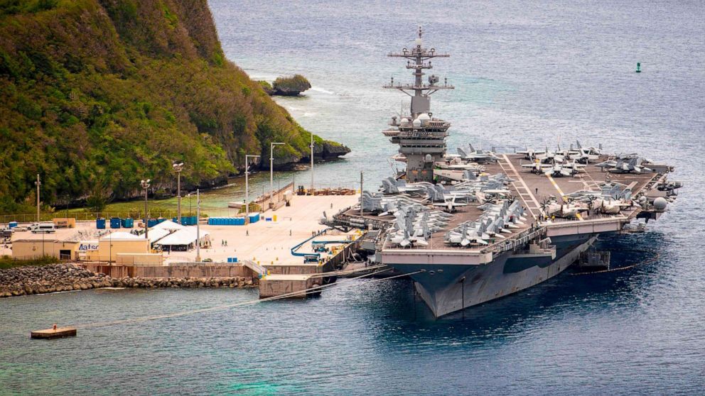 PHOTO: This US Navy photo obtained May 19, 2020 shows the aircraft carrier USS Theodore Roosevelt (CVN 71)as it is moored pier side at Naval Base Guam on May 15, 2020.