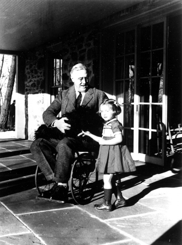 PHOTO: American President Franklin D. Roosevelt poses with his dog Fala and a young girl named Ruthie Bie on the porch at Top Cottage, Hyde Park, New York, February 1941.