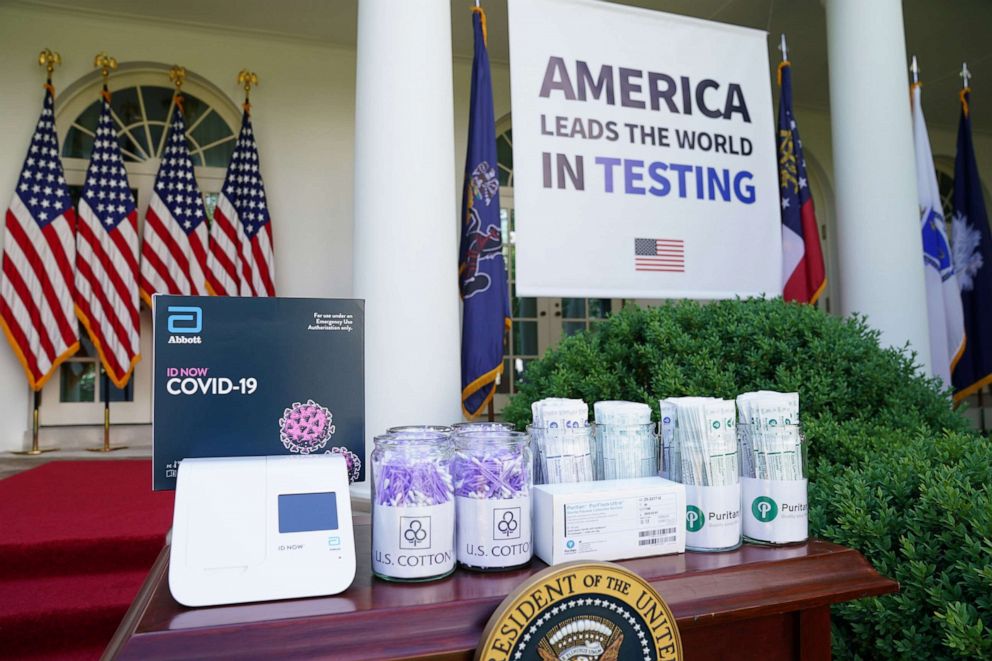 PHOTO: A coronavirus disease testing machine and the swabs used to administer tests sit on a table in the Rose Garden before President Donald Trump holds a coronavirus response press briefing at the White House, May 11, 2020. 