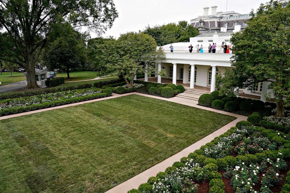 PHOTO: Members of the media view the renewed White House Rose Garden in Washington, Aug. 22, 2020.