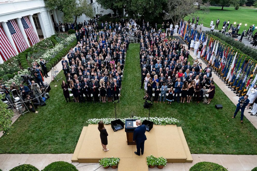 PHOTO: The crowd stands for President Donald Trump and Judge Amy Coney Barrett as they arrive for a news conference to announce Barrett as a nominee to the Supreme Court, in the Rose Garden at the White House in Washington, Sept. 26, 2020.