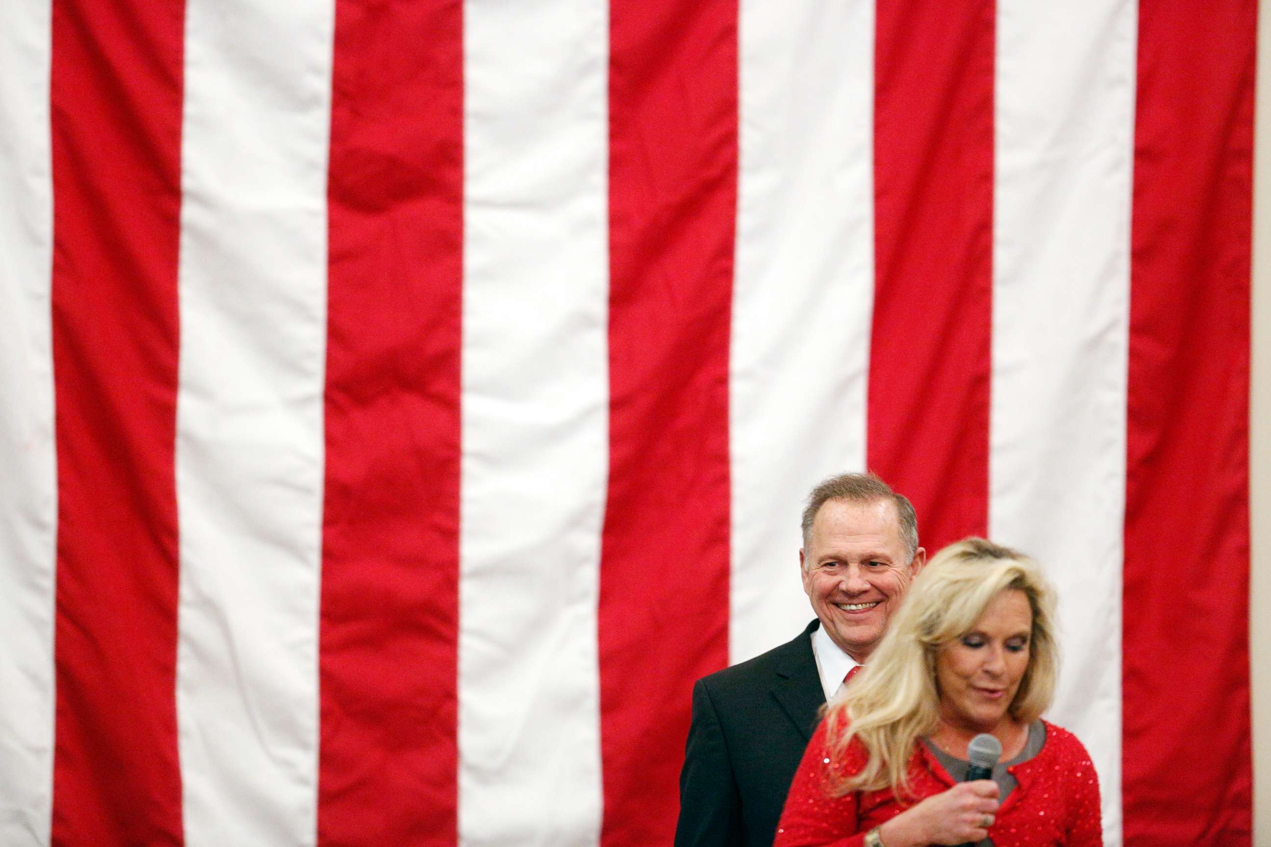 PHOTO: Roy Moore, Republican candidate for Senate from Alabama, reacts as his wife Kayla Moore speaks during a campaign rally in Midland City, Alabama, Dec. 11, 2017.