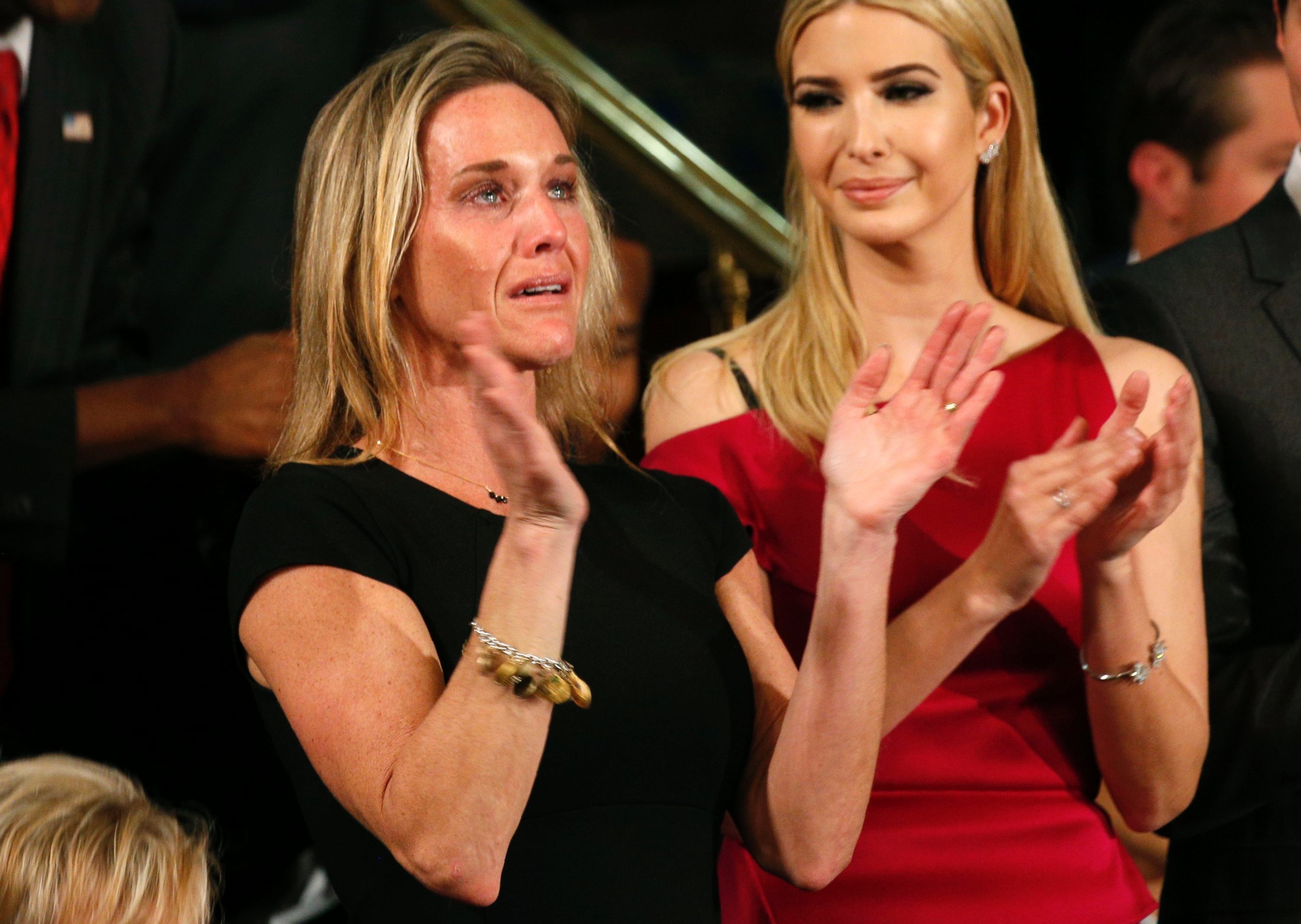 PHOTO: Carryn Owens, widow of Senior Chief Petty Officer William "Ryan" Owens, applauds after being mentioned by President Trump during his address to a joint session of the U.S. Congress on Feb. 28, 2017 in Washington, DC.