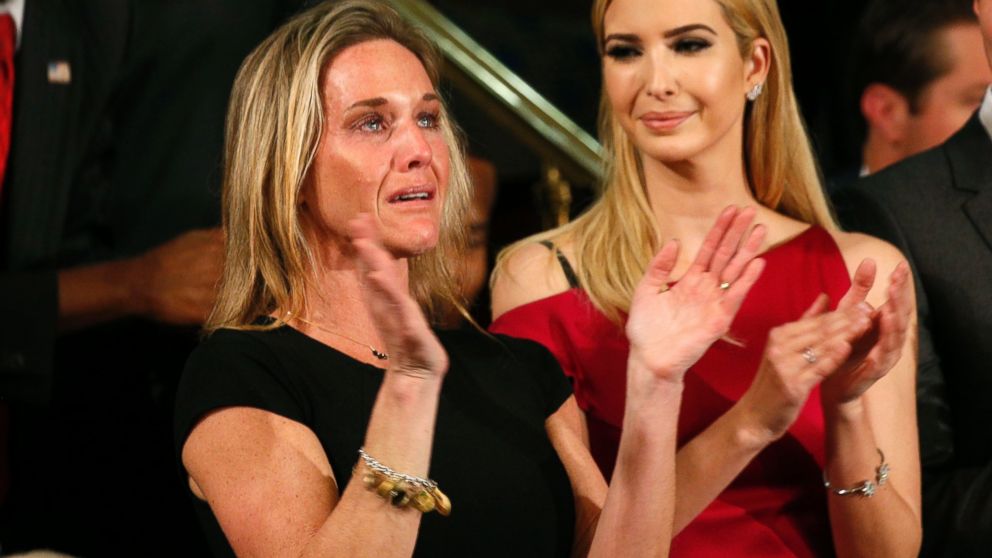 PHOTO: Carryn Owens, widow of Senior Chief Petty Officer William "Ryan" Owens, applauds after being mentioned by President Trump during his address to a joint session of the U.S. Congress on Feb. 28, 2017 in Washington, DC.