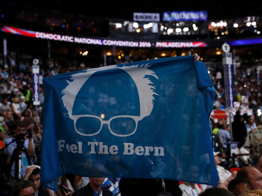 PHOTO: Supporters of Senator Bernie Sanders hold up a Feel the Bern banner as they protest on the floor during the first day of the Democratic National Convention in Philadelphia, July 25, 2016.