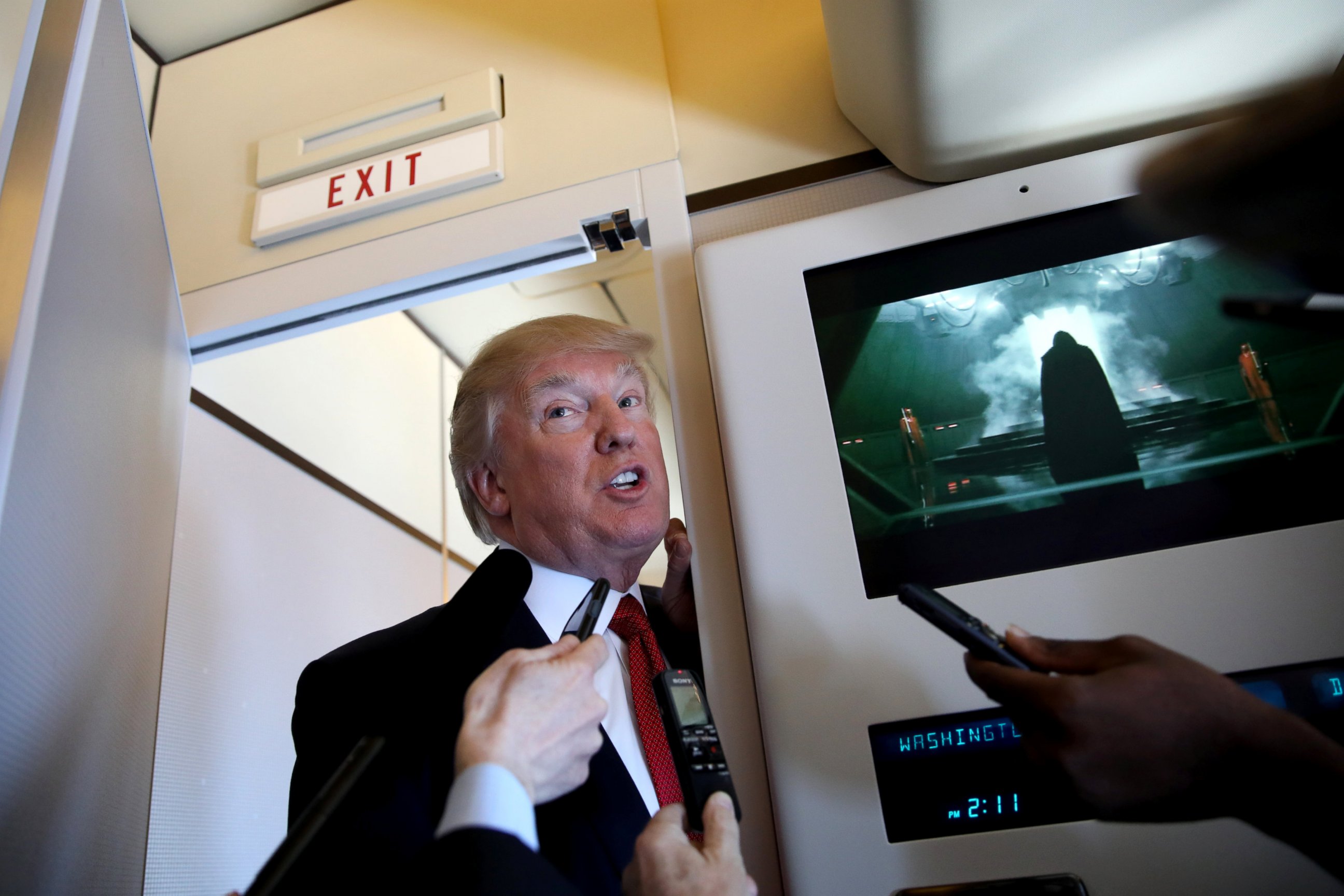 PHOTO: President Donald Trump talks to journalists on board Air Force One during his trip to Palm Beach, Fla., April 6, 2017.
