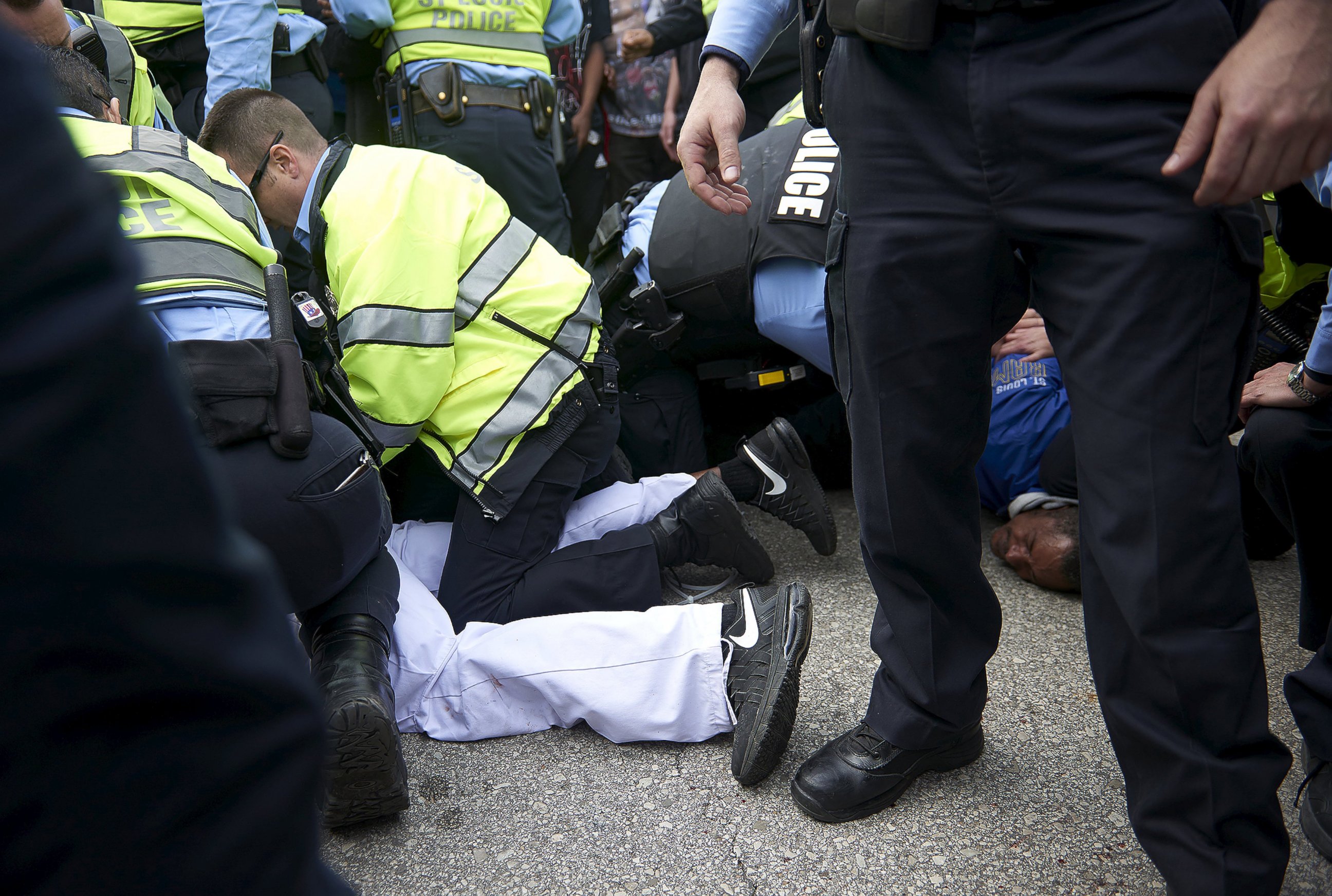 PHOTO: Police detain people after a fight between supporters and opponents of U.S. Republican presidential candidate Donald Trump, ahead of his speech outside the Peabody Opera House in St. Louis, Missouri, March 11, 2016.