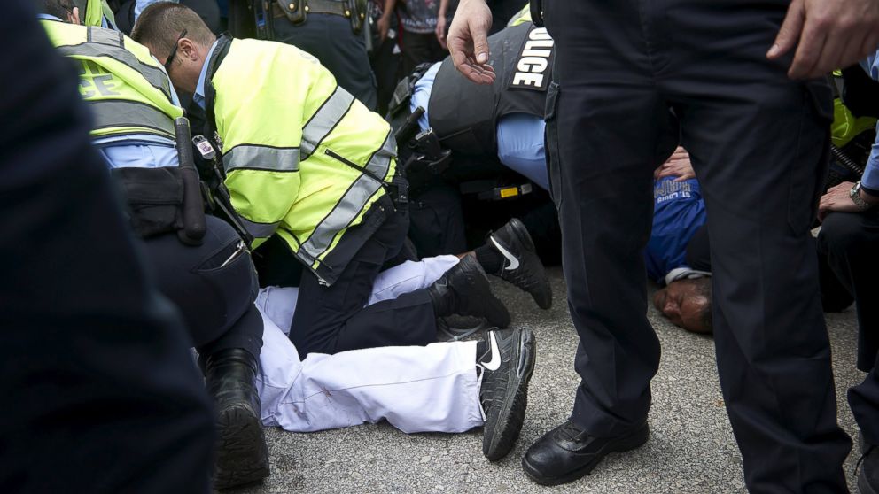 PHOTO: Police detain people after a fight between supporters and opponents of U.S. Republican presidential candidate Donald Trump, ahead of his speech outside the Peabody Opera House in St. Louis, Missouri, March 11, 2016.