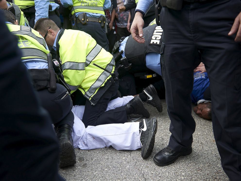 PHOTO: Police detain people after a fight between supporters and opponents of U.S. Republican presidential candidate Donald Trump, ahead of his speech outside the Peabody Opera House in St. Louis, Missouri, March 11, 2016.
