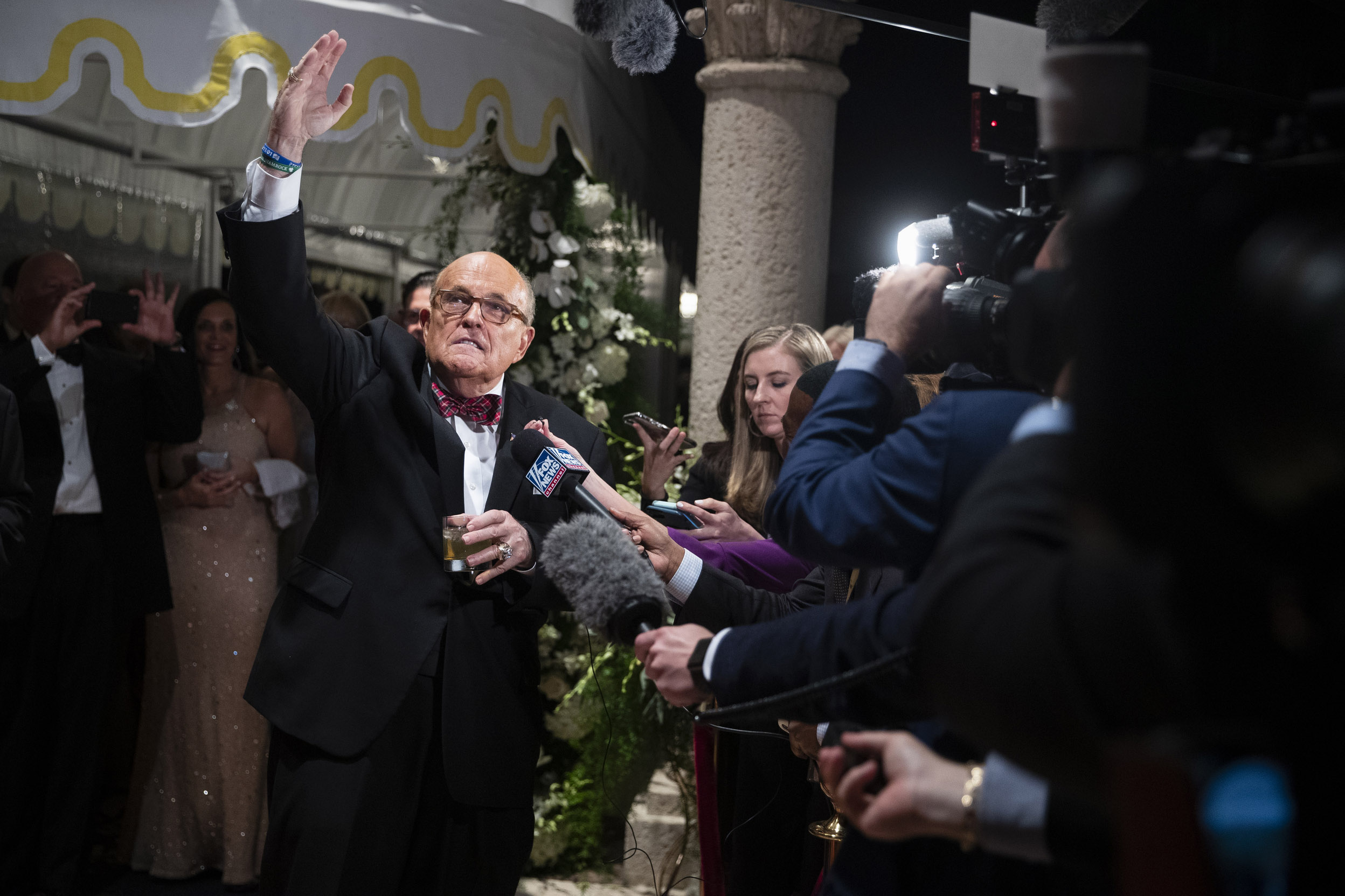 PHOTO: Former New York Mayor Rudy Giuliani, an attorney for President Donald Trump, speaks to reporters as he arrives for a New Year's Eve party hosted by President Donald Trump at his Mar-a-Lago property, Dec. 31, 2019, in Palm Beach, Fla.