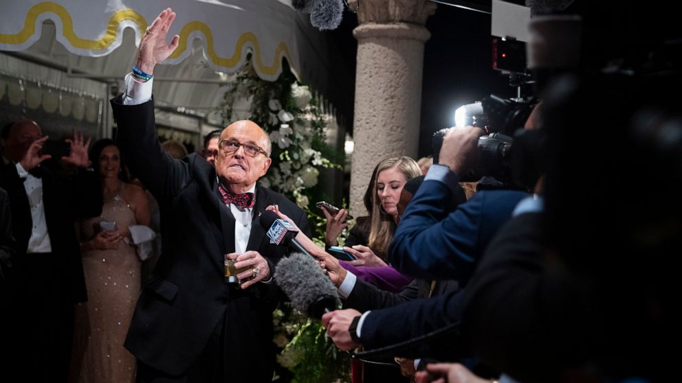 PHOTO: Former New York Mayor Rudy Giuliani, an attorney for President Donald Trump, speaks to reporters as he arrives for a New Year's Eve party hosted by President Donald Trump at his Mar-a-Lago property, Dec. 31, 2019, in Palm Beach, Fla.