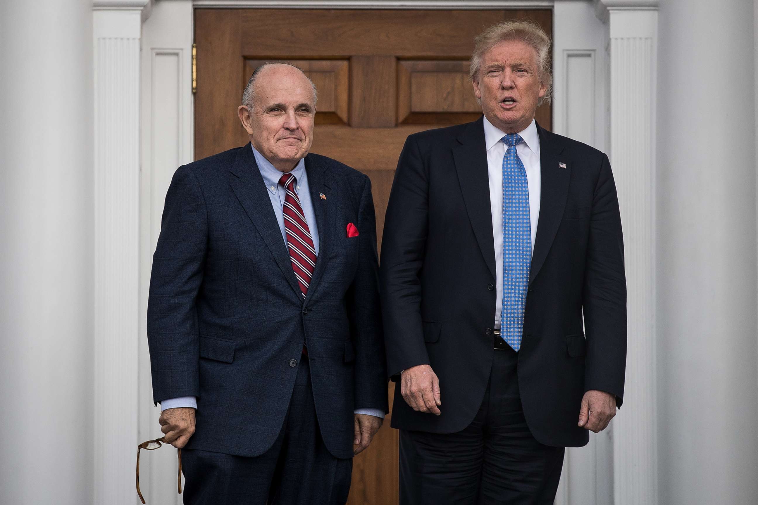 PHOTO: Former New York City mayor Rudy Giuliani, left, stands with president-elect Donald Trump before their meeting at Trump International Golf Club, Nov. 20, 2016 in Bedminster Township, N.J.