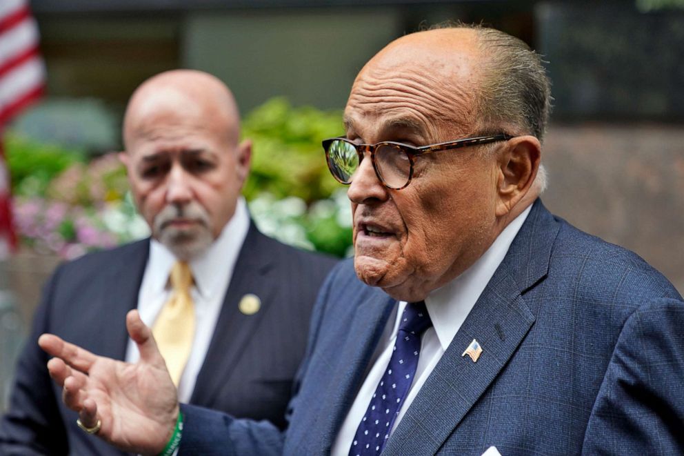 PHOTO: Former New York Mayor Rudolph Giuliani, right, accompanied by Bernard Kerik, former commissioner of the New York Police Department, is interviewed at the Tunnel to Towers ceremony, Sept. 11, 2020, in New York.