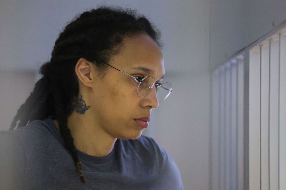 PHOTO: WNBA basketball player Brittney Griner, who was detained at Moscow's Sheremetyevo airport and later charged with illegal possession of cannabis, waits for the verdict inside a defendants' cage during a hearing in Khimki, Aug. 4, 2022.