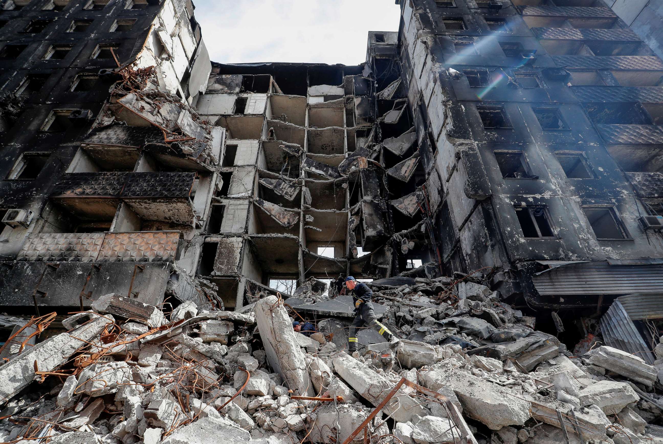 PHOTO: Emergency workers remove debris of a building destroyed in the course of the Ukraine-Russia conflict, in the southern port city of Mariupol, Ukraine April 10, 2022.