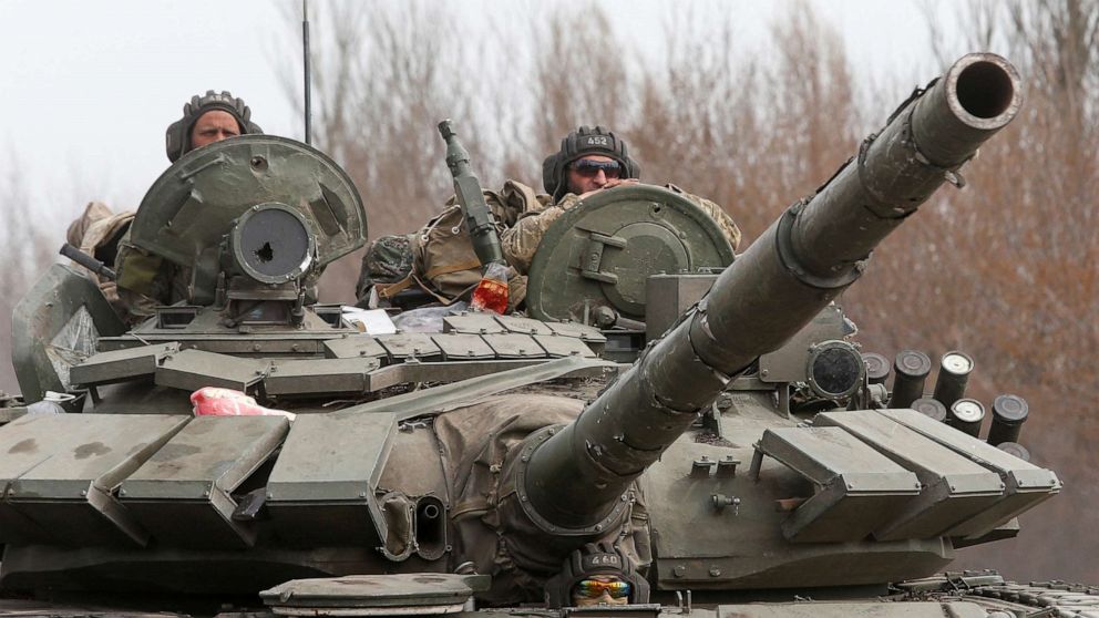 PHOTO: Service members of pro-Russian troops drive a tank during Ukraine-Russia conflict on a road outside the southern port city of Mariupol, Ukraine April 10, 2022.