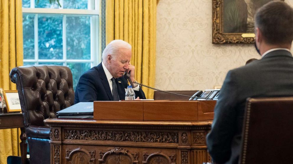 PHOTO: President Joe Biden talks on the phone with Ukrainian President Volodymyr Zelensky from the Oval Office at the White House, Dec. 09, 2021.