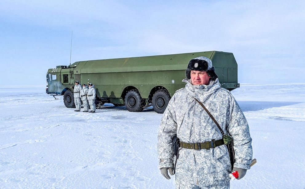 PHOTO: A Russian officer and soldiers stand next to a special military truck at the Russian northern military base on Kotelny island, beyond the Arctic Circle, on April 3, 2019.
