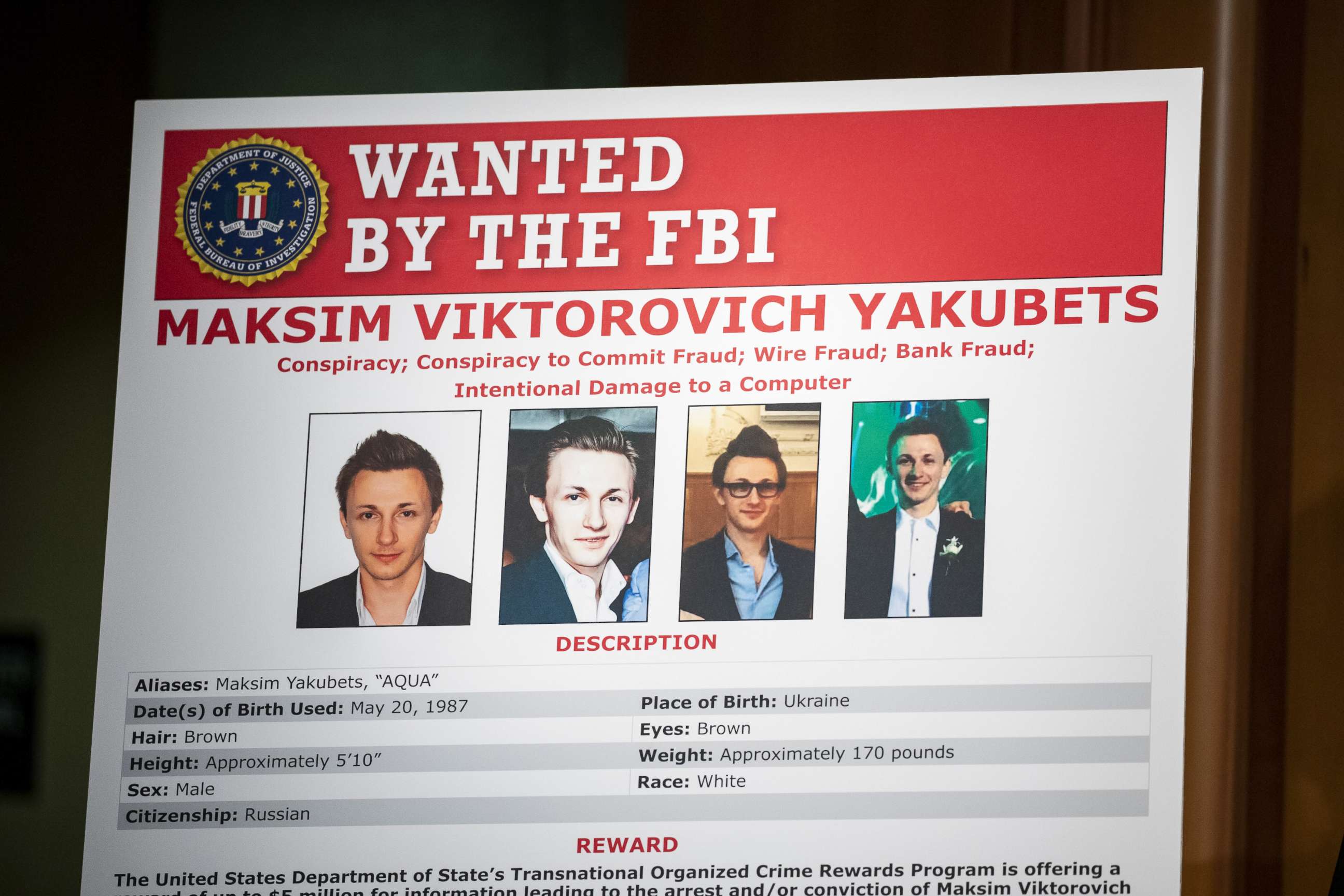 PHOTO: The wanted poster of Maksim Viktorovich Yakubets is displayed at the U.S. Department of Justice on Dec. 5, 2019 in Washington, D.C.