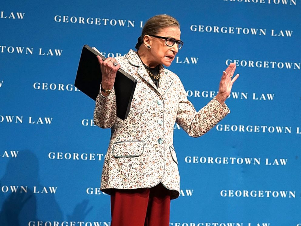 PHOTO: Ruth Bader Ginsburg (R), US Supreme Court Justice, greets students as she arrives at a conference on September 26, 2018 at Georgetown University Law Center in Washington, DC