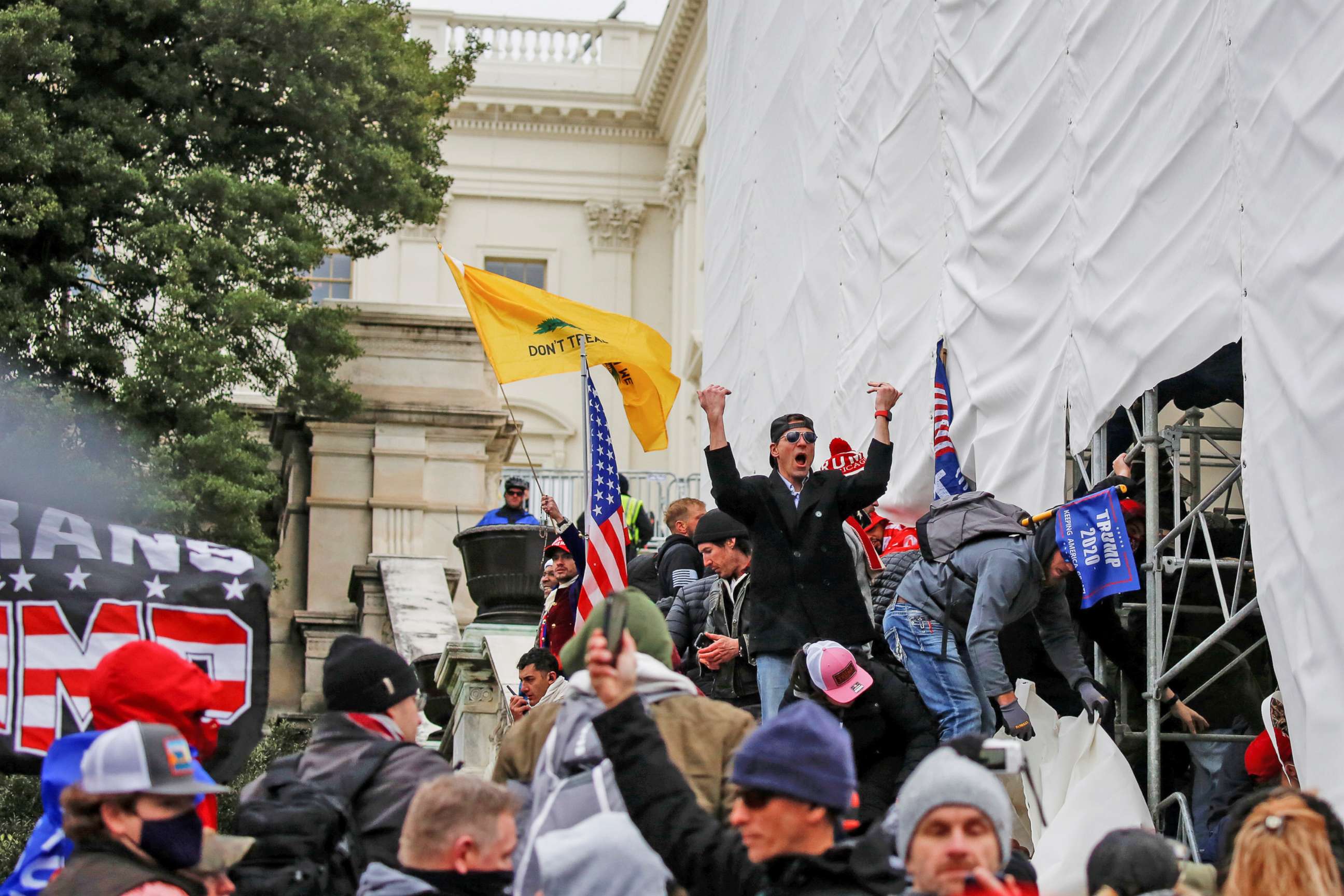 PHOTO: Supporters of President Donald Trump, including a person identified as Ryan Kelley, center, make their way past barriers at the U.S. Capitol during a protest against the certification of the 2020 presidential election results, in Washington, D.C.