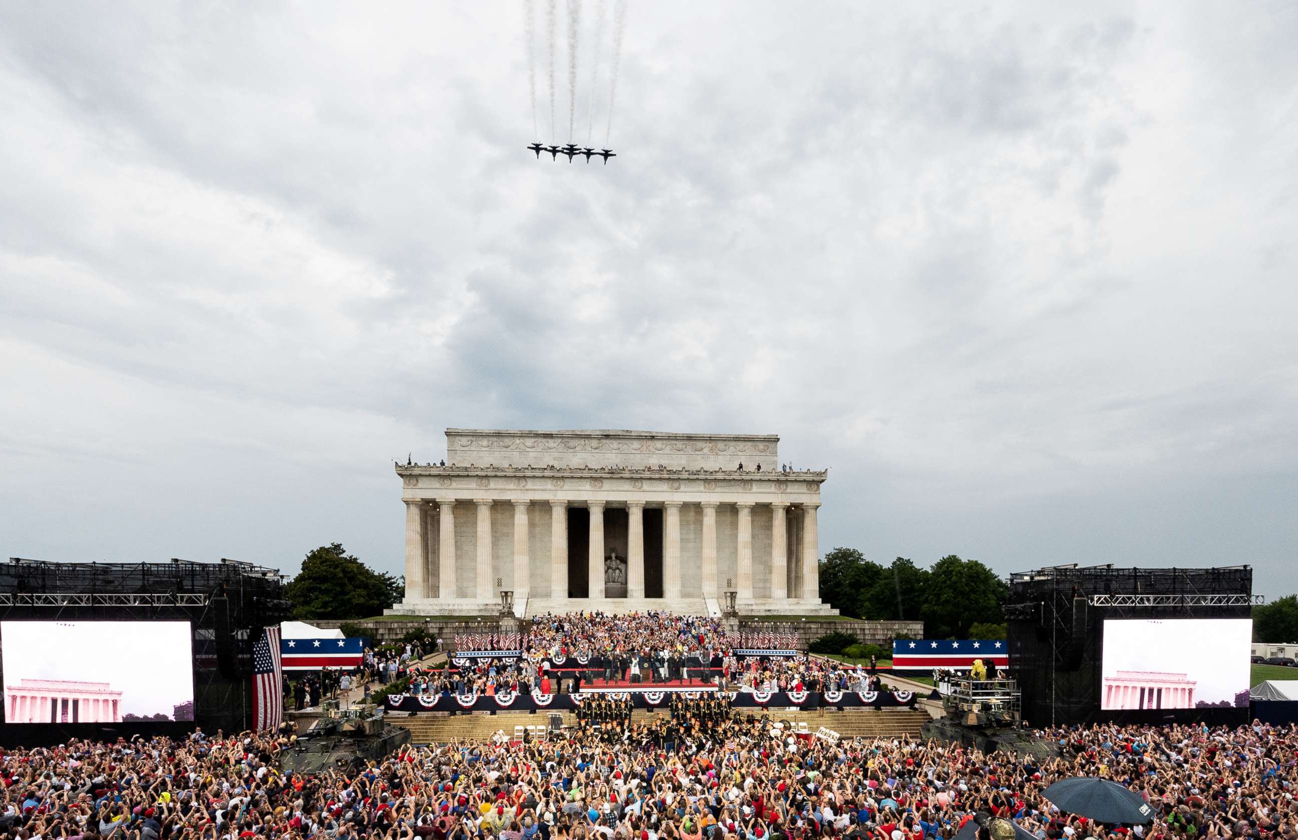 PHOTO: President Donald Trump speaks at the National Mall as a military flyover takes place during the Salute To America event on July 4, 2019 in Washington.