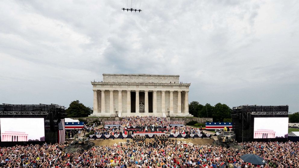 PHOTO: President Donald Trump speaks at the National Mall as a military flyover takes place during the Salute To America event on July 4, 2019 in Washington.
