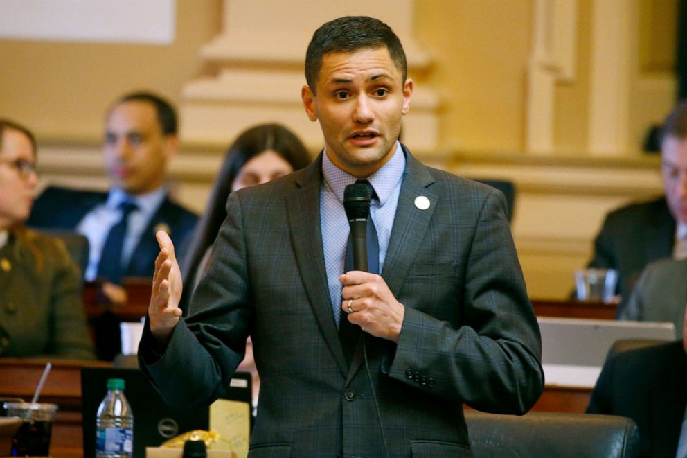 PHOTO: Del. Sam Rasoul gestures during debate on the renewable energy bill on the floor of the House at the Capitol, March 5 , 2020, in Richmond, Va.