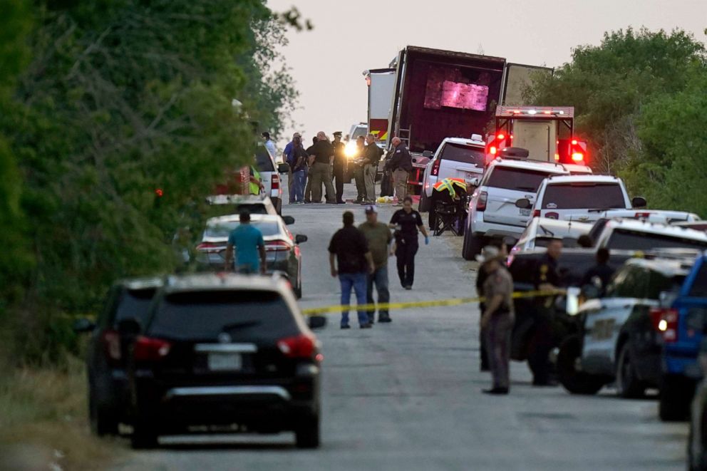 PHOTO: In this June 27, 2022, file photo, first responders work the scene where officials say dozens of people have been found dead and others were taken to hospitals after a semitrailer containing suspected migrants was found, in San Antonio, Texas.
