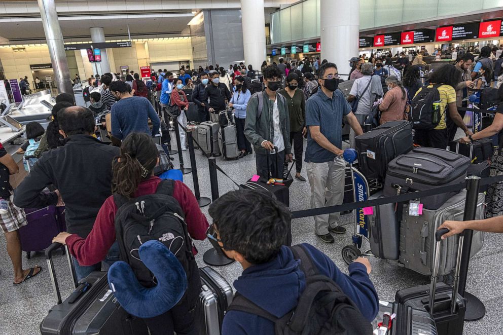 PHOTO: Travelers wait to check-in in the international terminal at San Francisco International Airport in San Francisco, on June 13, 2022.