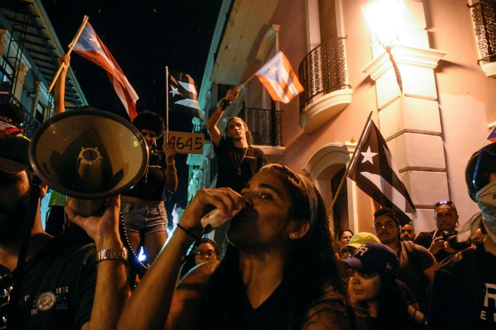 PHOTO: Demonstrators chant, sing, and wave Puerto Rican flags during the sixth day of protest calling for the resignation of Governor Ricardo Rossello in San Juan, Puerto Rico, July 18, 2019.