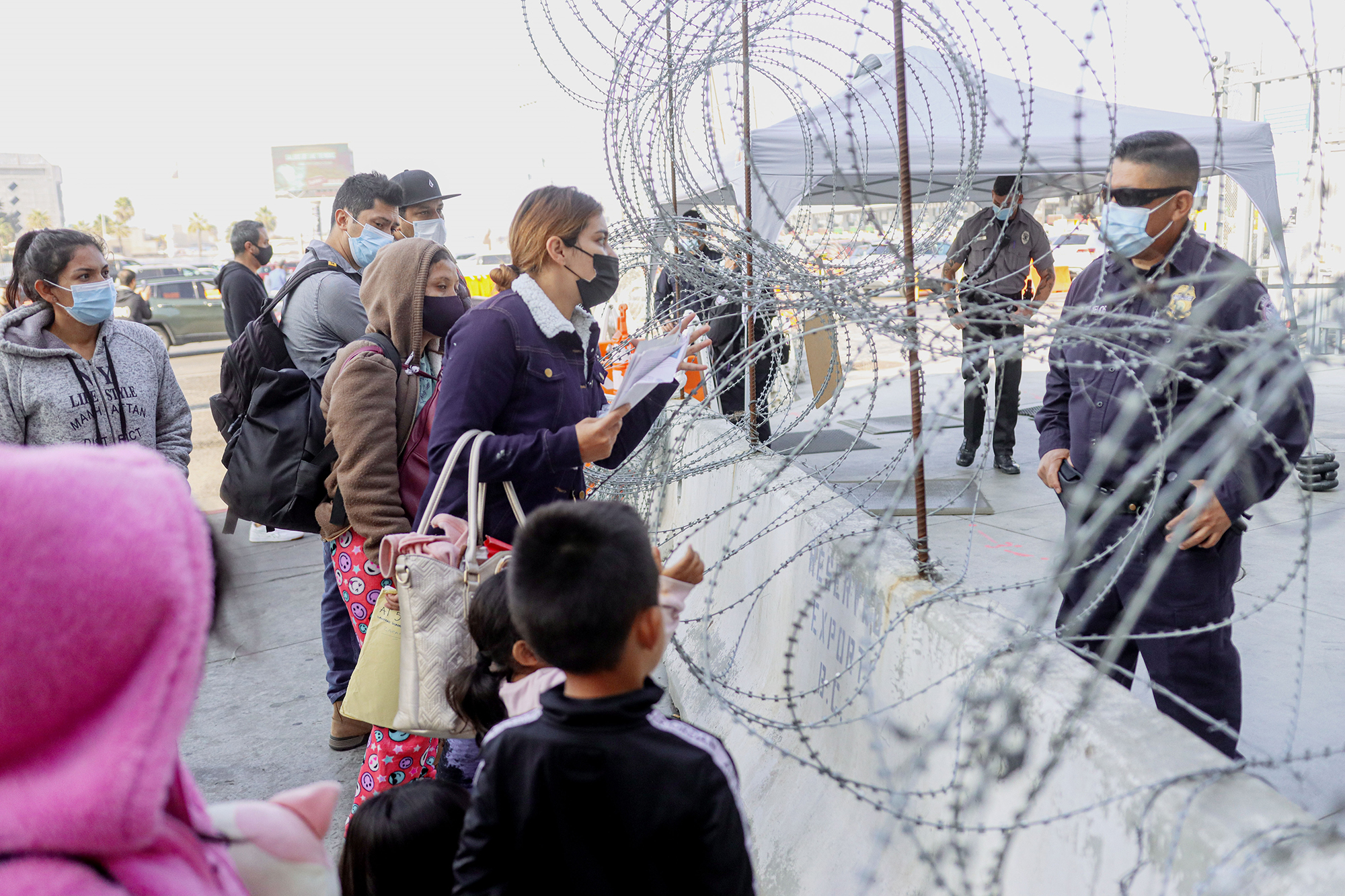 PHOTO: Customs agents check vaccination cards at the San Ysidro Port of Entry on Nov. 8, 2021 in Tijuana, Mexico. 