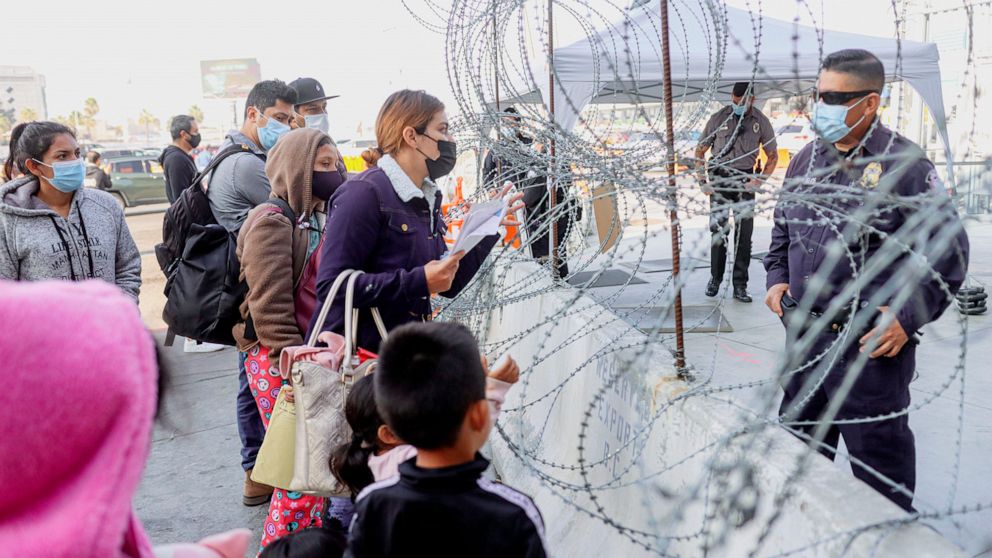 PHOTO: Customs agents check vaccination cards at the San Ysidro Port of Entry on Nov. 8, 2021 in Tijuana, Mexico. 