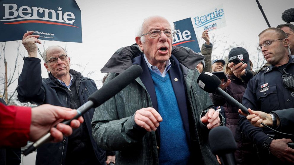 PHOTO: Democratic presidential candidate Senator Bernie Sanders speaks to the media at a polling station at the McDonough School during the New Hampshire presidential primary election in Manchester, N.H., Feb. 11, 2020. 