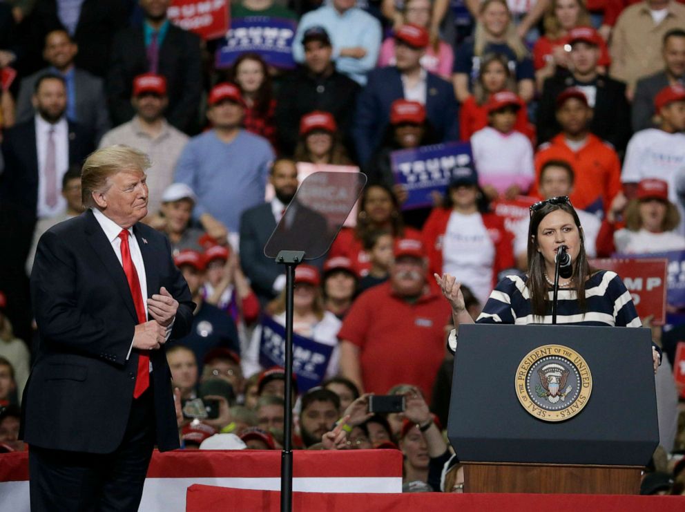 PHOTO:President Donald Trump listens to White House Press Secretary Sarah Huckabee Sanders speak at a Make America Great Again rally, April 27, 2019, in Green Bay, Wis.