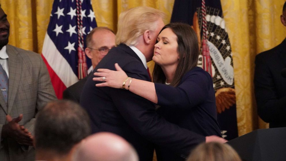 PHOTO: Outgoing White House Press Secretary Sarah Huckabee Sanders hugs President Donald Trump during a second chance hiring and criminal justice reform event at the White House, June 13, 2019. 