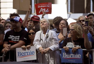PHOTO: Dr. Rene Rubin listens to Democratic presidential candidate Bernie Sanders, make remarks at a rally alongside unions, hospital workers and community members against the closure of Hahnemann University Hospital in Philadelphia, July 15, 2019.