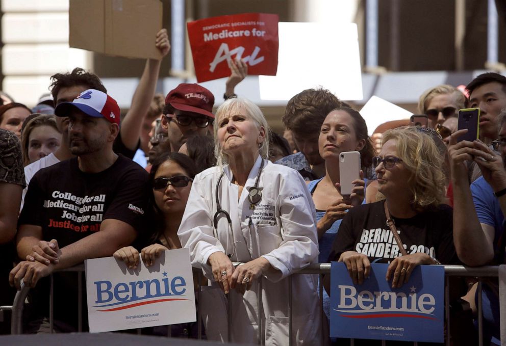 PHOTO: Dr. Rene Rubin listens to Democratic presidential candidate Bernie Sanders,  make remarks at a rally alongside unions, hospital workers and community members against the closure of Hahnemann University Hospital in Philadelphia, July 15, 2019.
