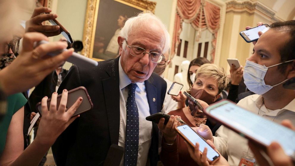 PHOTO: Sen. Bernie Sanders speaks with reporters after leaving a Senate Democrat Luncheon, Oct. 19, 2021, in Washington, D.C.