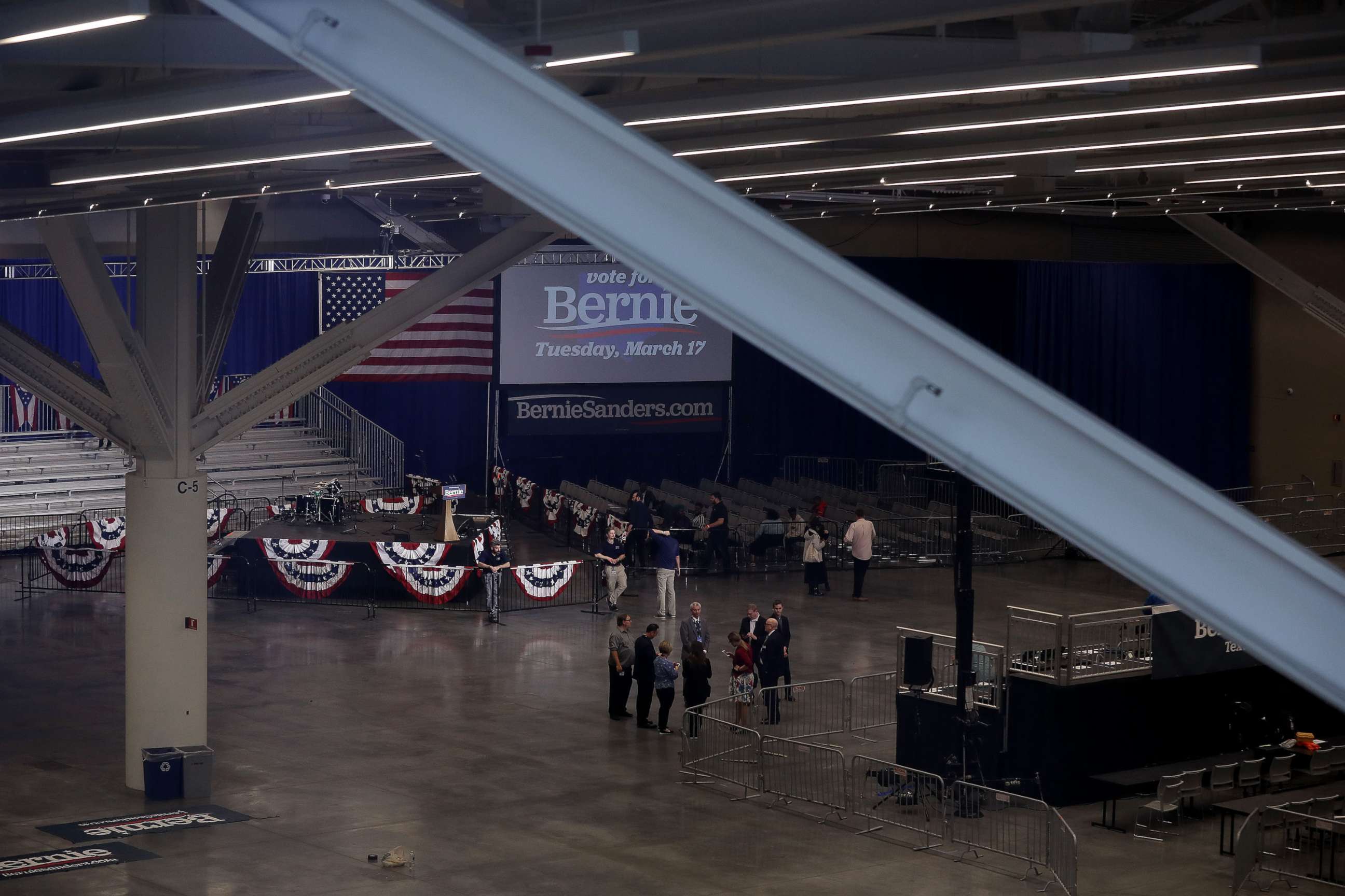PHOTO: Campaign staff and other gather inside the Huntington Convention Center after Democratic presidential candidate Sen. Bernie Sanders canceled his campaign event due to concerns about the coronavirus COVID-19,  March 10, 2020 in Cleveland.